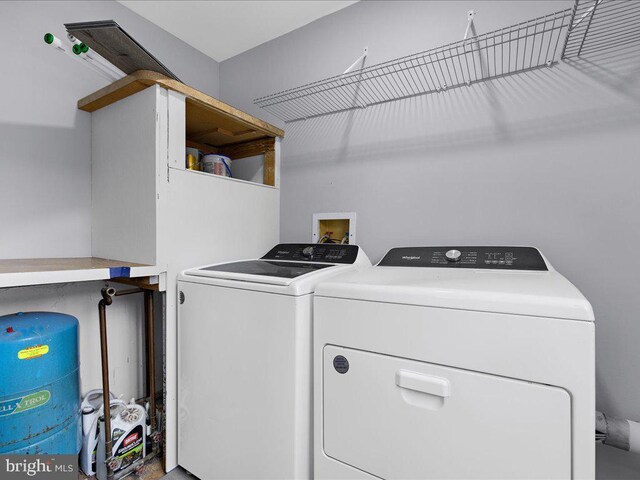 laundry area with washer and clothes dryer