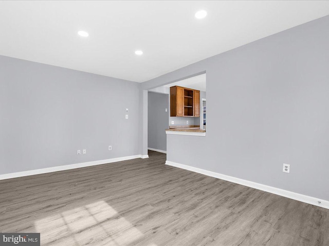 unfurnished living room with light wood-type flooring