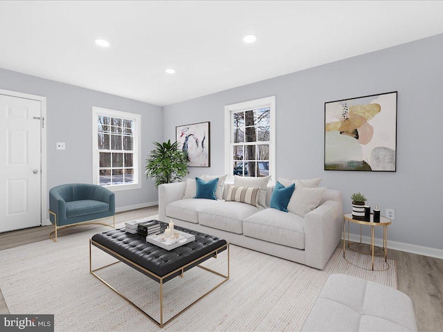 living room featuring plenty of natural light and light hardwood / wood-style floors