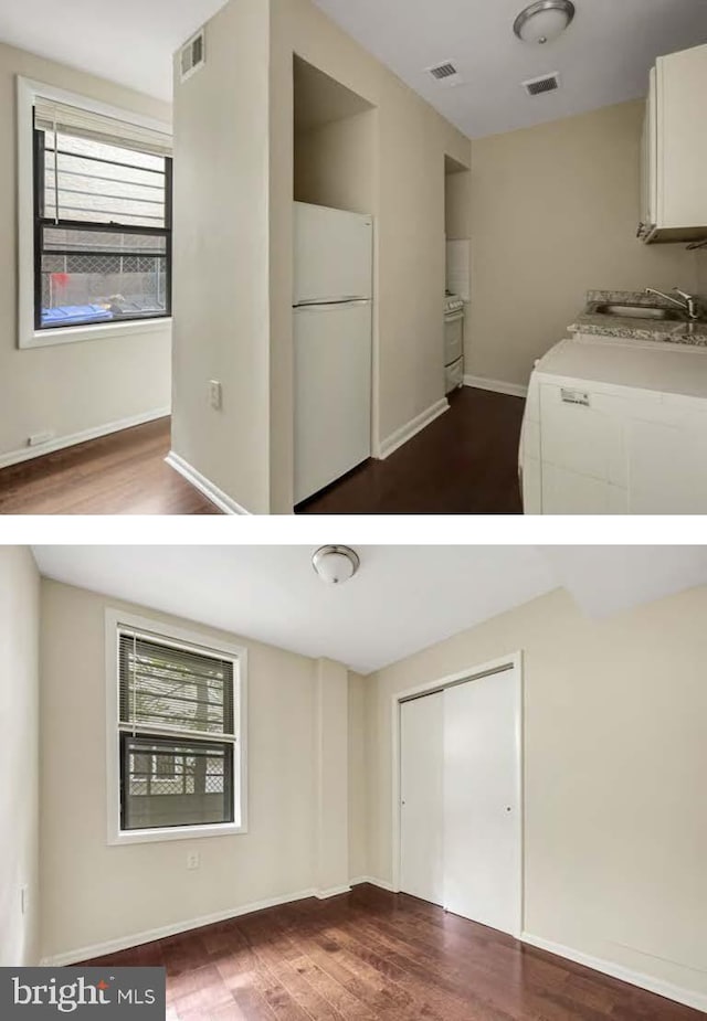 interior space featuring sink, hardwood / wood-style flooring, and washer / dryer