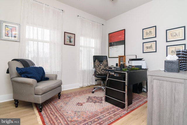 home office featuring light hardwood / wood-style floors