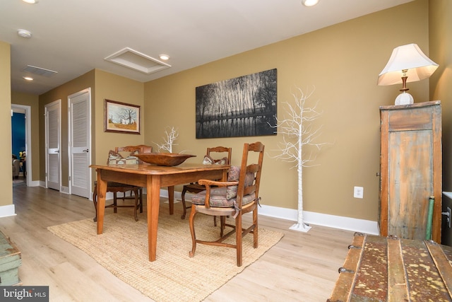 dining area featuring light wood-type flooring