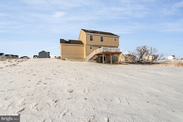 rear view of house featuring a deck