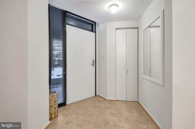 hallway featuring light tile patterned flooring