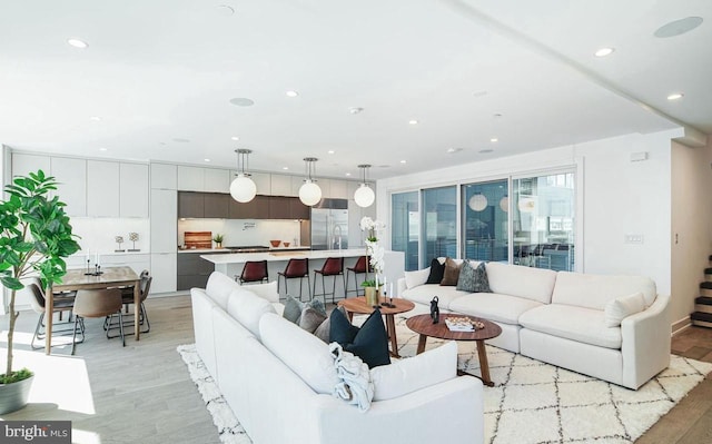 living room with light hardwood / wood-style flooring