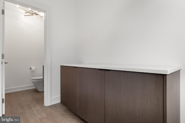 bathroom featuring toilet and hardwood / wood-style floors