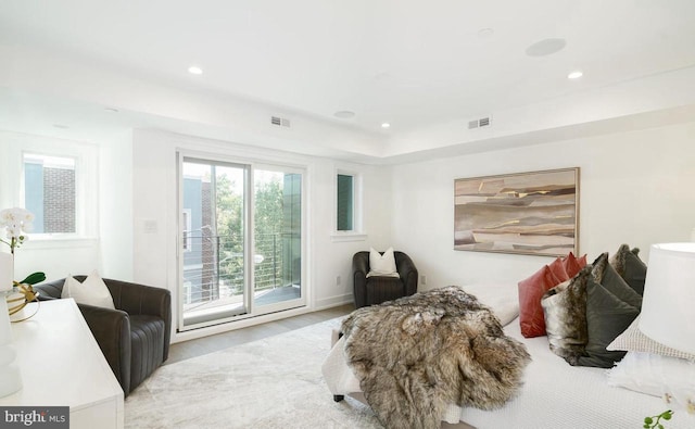 bedroom with light hardwood / wood-style flooring and access to outside