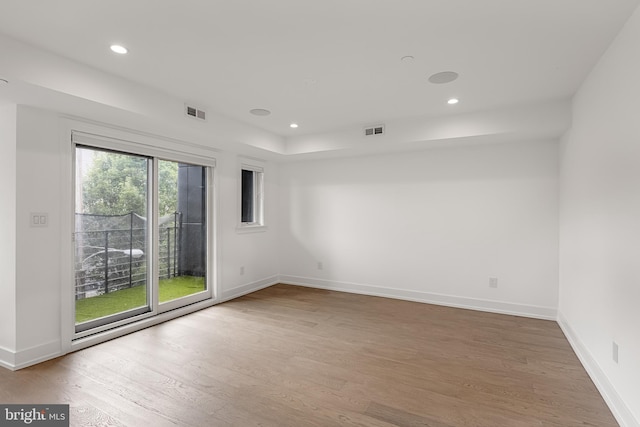 spare room featuring hardwood / wood-style floors