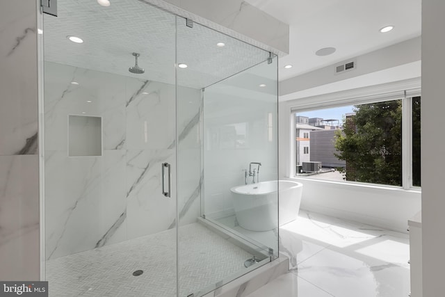 bathroom featuring plus walk in shower