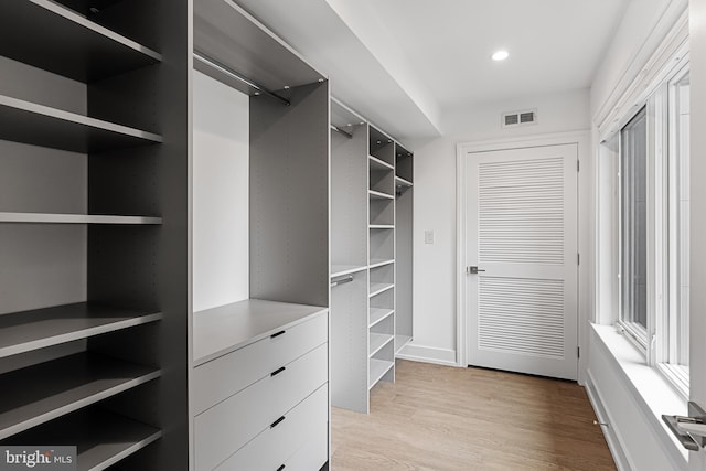 spacious closet featuring light wood-type flooring