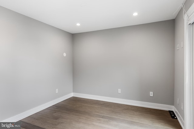 unfurnished room featuring wood-type flooring