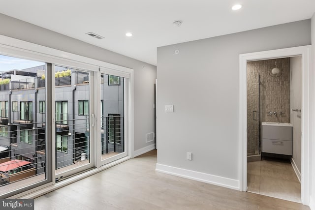 unfurnished room featuring light wood-type flooring