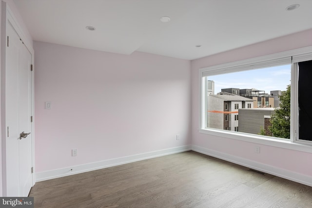 empty room featuring hardwood / wood-style floors