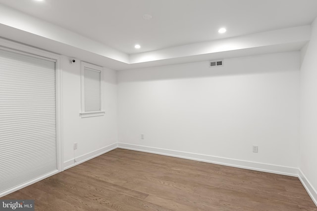 basement with hardwood / wood-style flooring