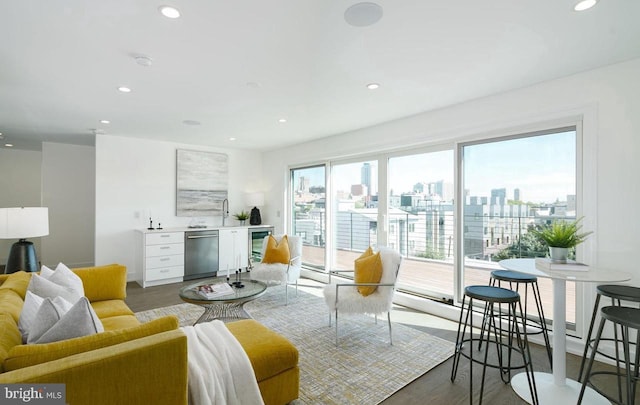 living room with hardwood / wood-style flooring and beverage cooler