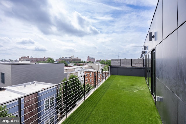 view of yard with a balcony