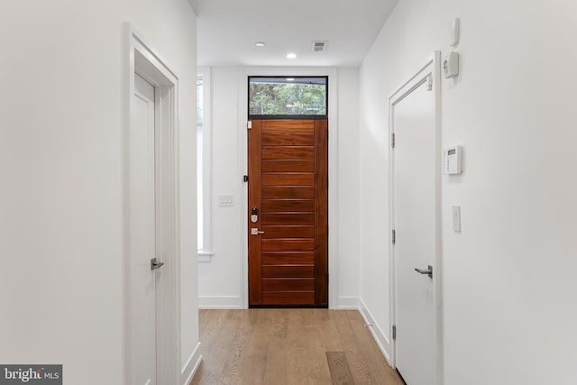 doorway with light hardwood / wood-style floors