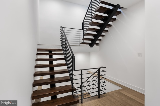 stairway with wood-type flooring