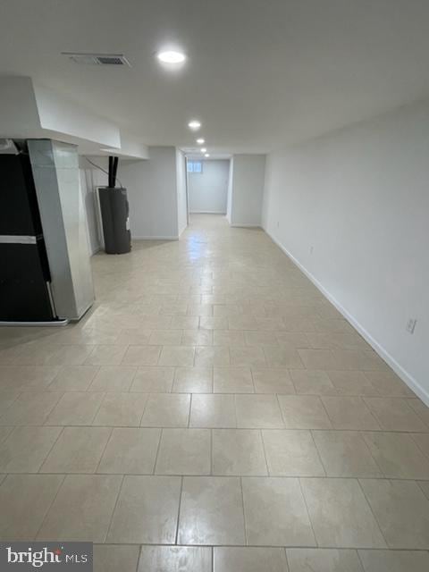 basement with heating unit and water heater