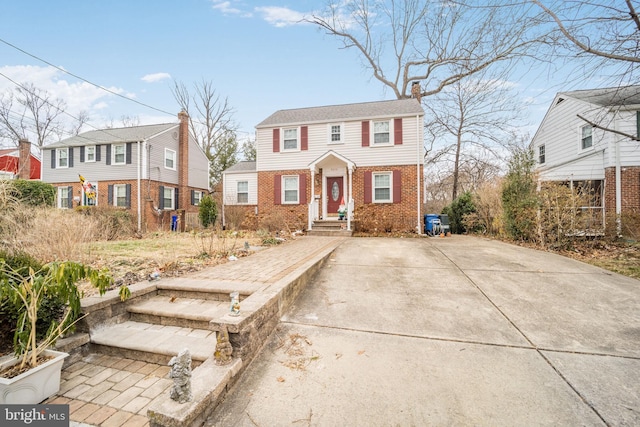 view of front of house with a residential view and brick siding