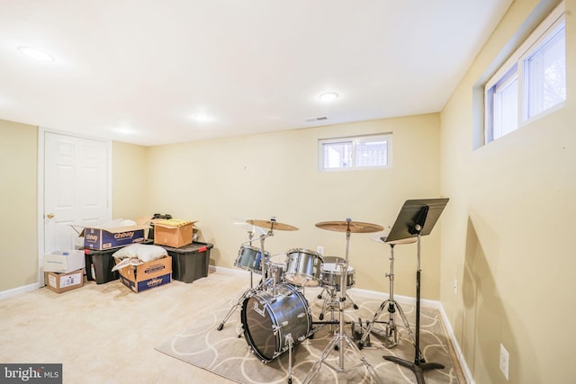 playroom with light carpet, visible vents, and baseboards