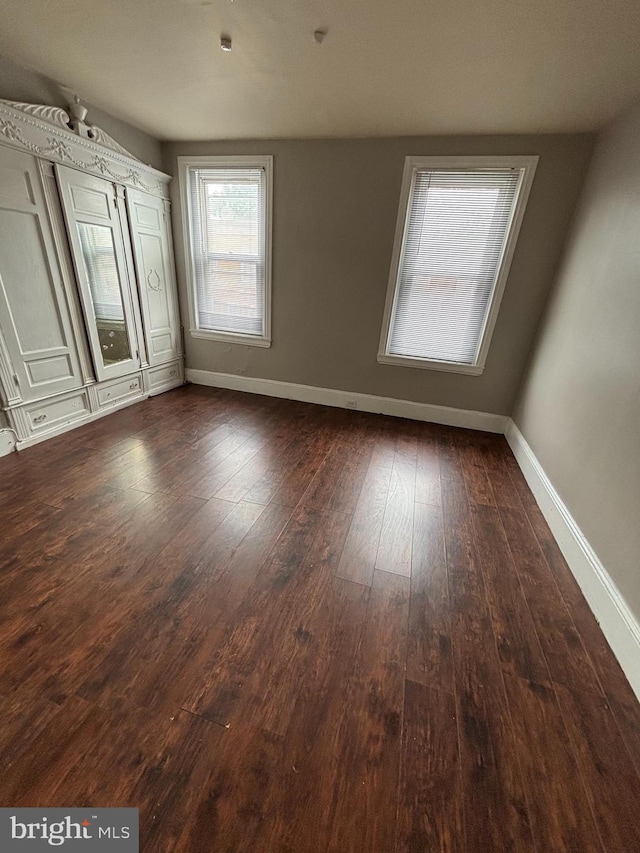1904 E Orleans St, Philadelphia, PA 19134 - spare room with baseboards and dark wood-type flooring