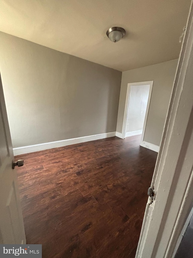 1904 E Orleans St, Philadelphia, PA 19134 - spare room featuring dark wood-type flooring and baseboards