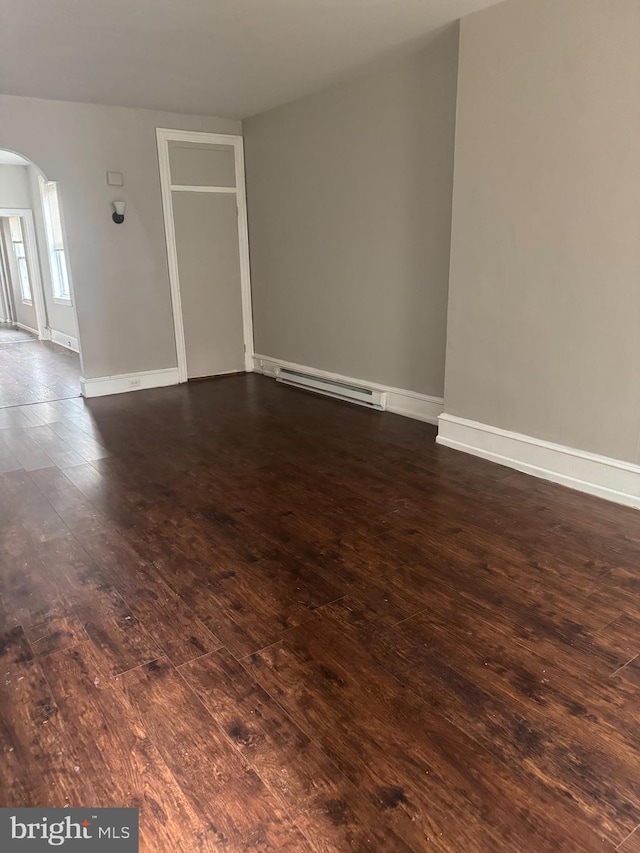 1904 E Orleans St, Philadelphia, PA 19134 - unfurnished room featuring dark wood-type flooring and a baseboard radiator