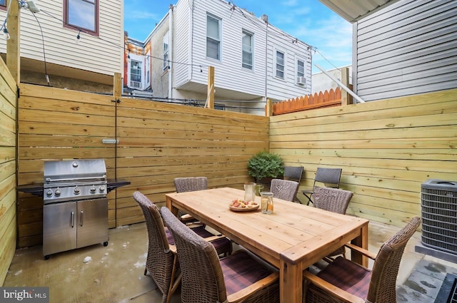 view of patio with a grill and central air condition unit