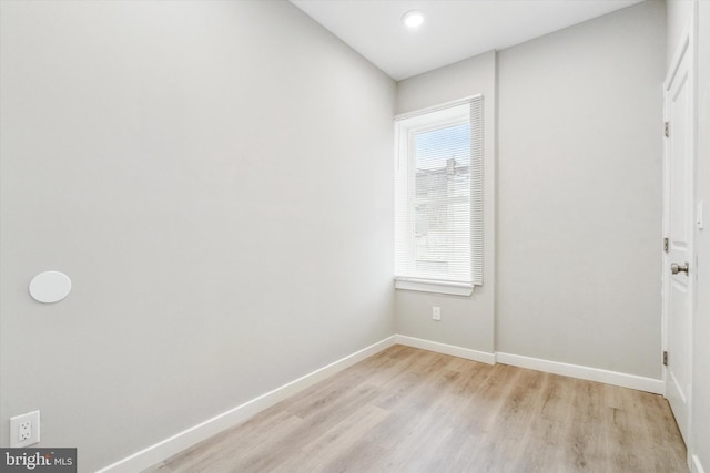 spare room featuring light hardwood / wood-style floors