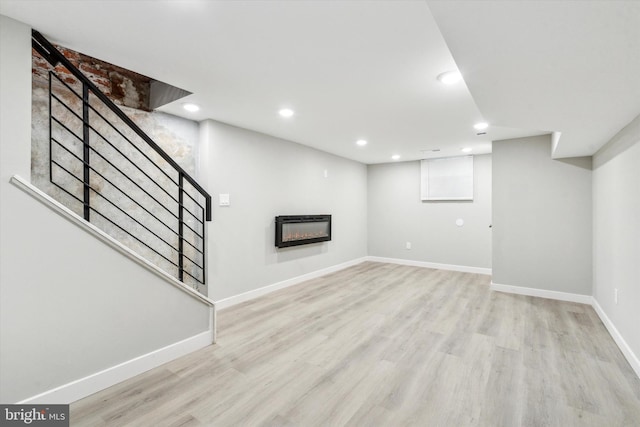 basement featuring light wood-type flooring