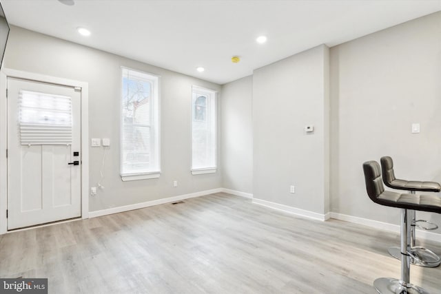 foyer with light hardwood / wood-style flooring