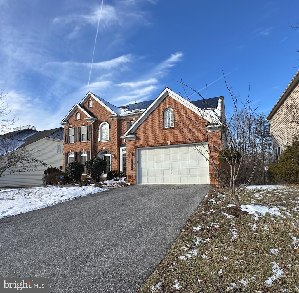 front of property with a garage