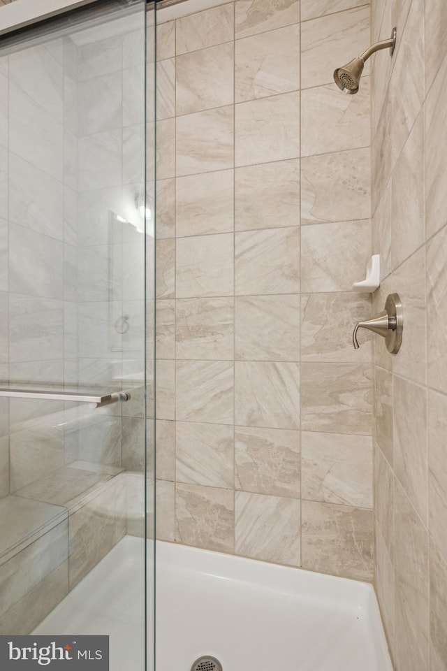 bathroom featuring an enclosed shower