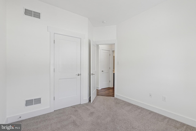 unfurnished bedroom featuring carpet