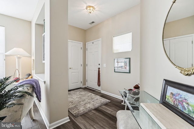 entrance foyer featuring dark hardwood / wood-style floors