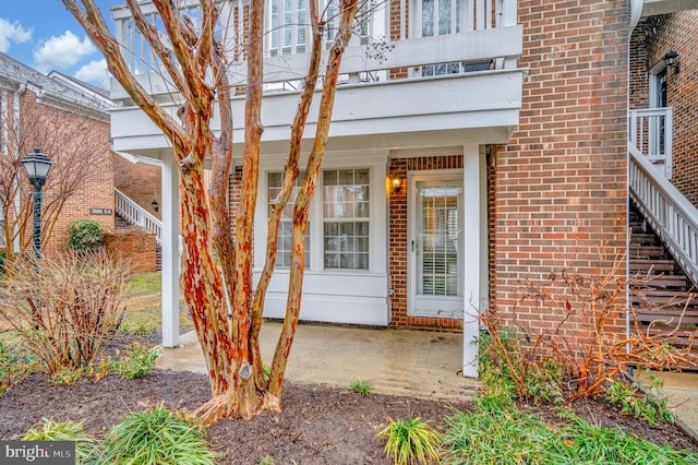 doorway to property featuring a balcony