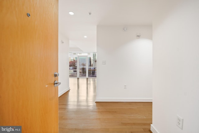 hallway with wood-type flooring