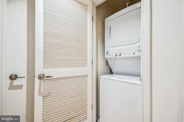 laundry room featuring stacked washer / dryer