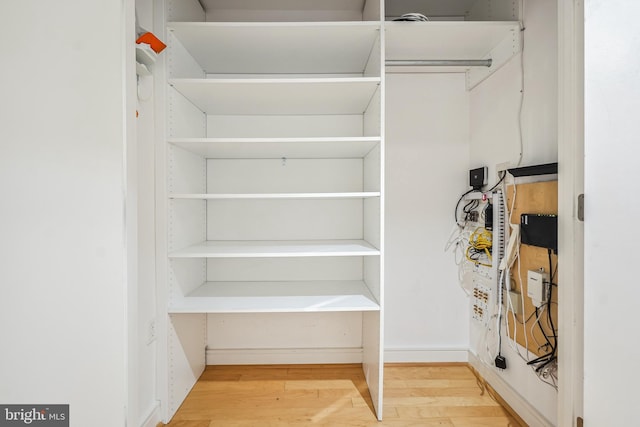 walk in closet featuring hardwood / wood-style floors