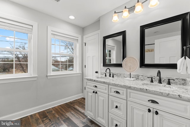 bathroom featuring vanity and hardwood / wood-style floors