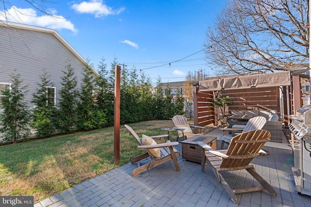 view of patio featuring a fire pit