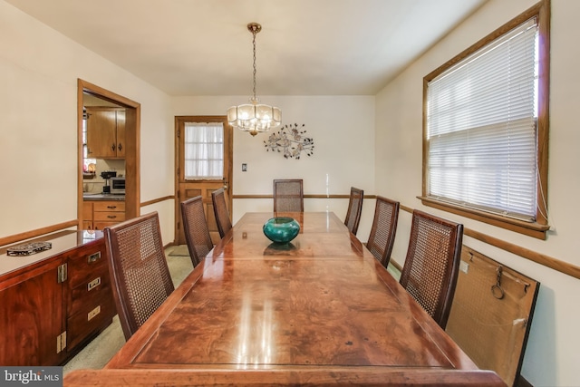 dining space featuring a chandelier