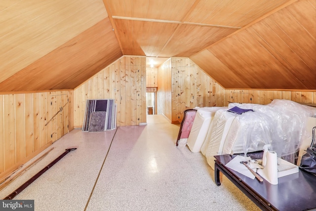 bedroom featuring lofted ceiling, wooden ceiling, and wood walls