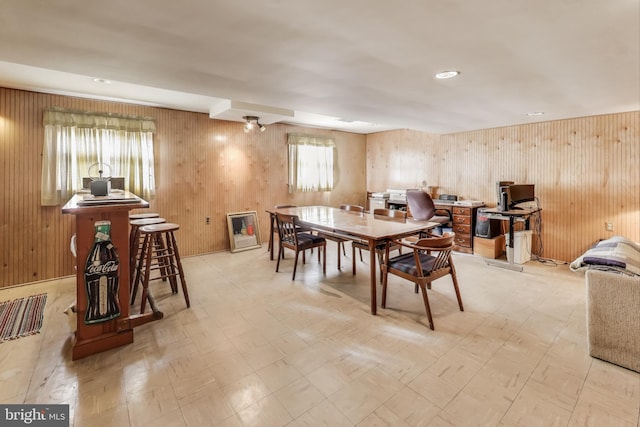 dining area with wood walls