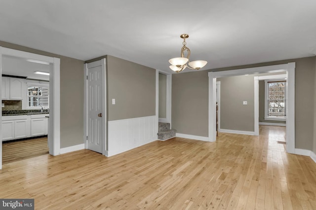 unfurnished dining area featuring light hardwood / wood-style floors