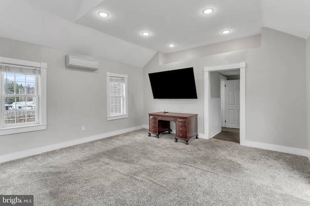 unfurnished living room with a wall mounted air conditioner, vaulted ceiling, and carpet