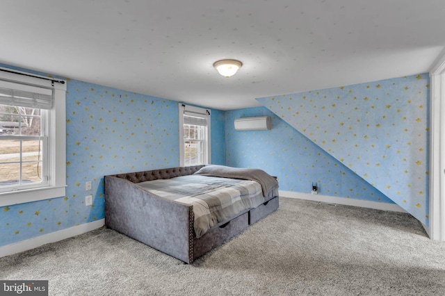 bedroom with carpet floors and a wall unit AC