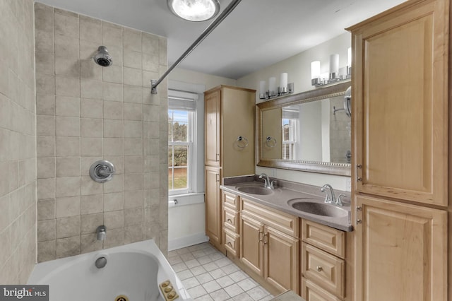 bathroom featuring vanity, tiled shower / bath combo, and tile patterned floors