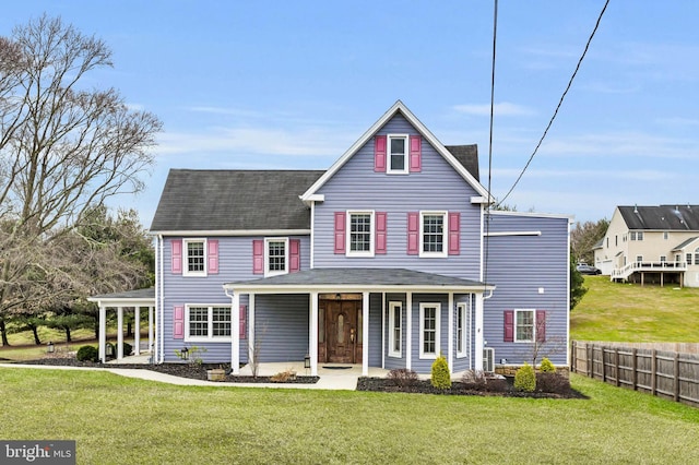 view of front of house with covered porch and a front lawn